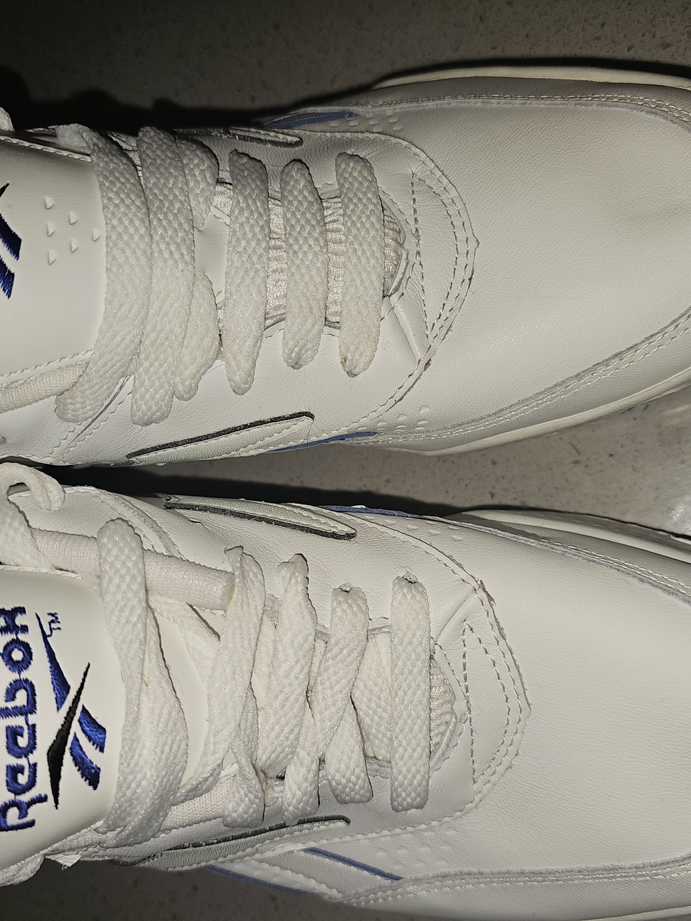 Reebok White Sneakers with Blue Logo Accents